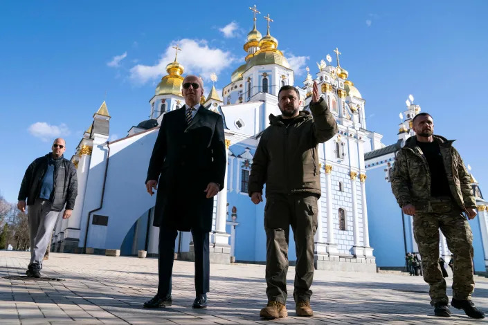 President Joe Biden walks with Ukrainian President Volodymyr Zelenskyy at St. Michael's Golden-Domed Cathedral during an unannounced visit, in Kyiv, Ukraine.