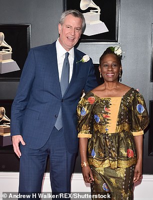 32110468-8641213-McCray_pictured_with_Bill_de_Blasio_enjoys_a_core_team_of_eight_-a-22_1597797601922.jpg