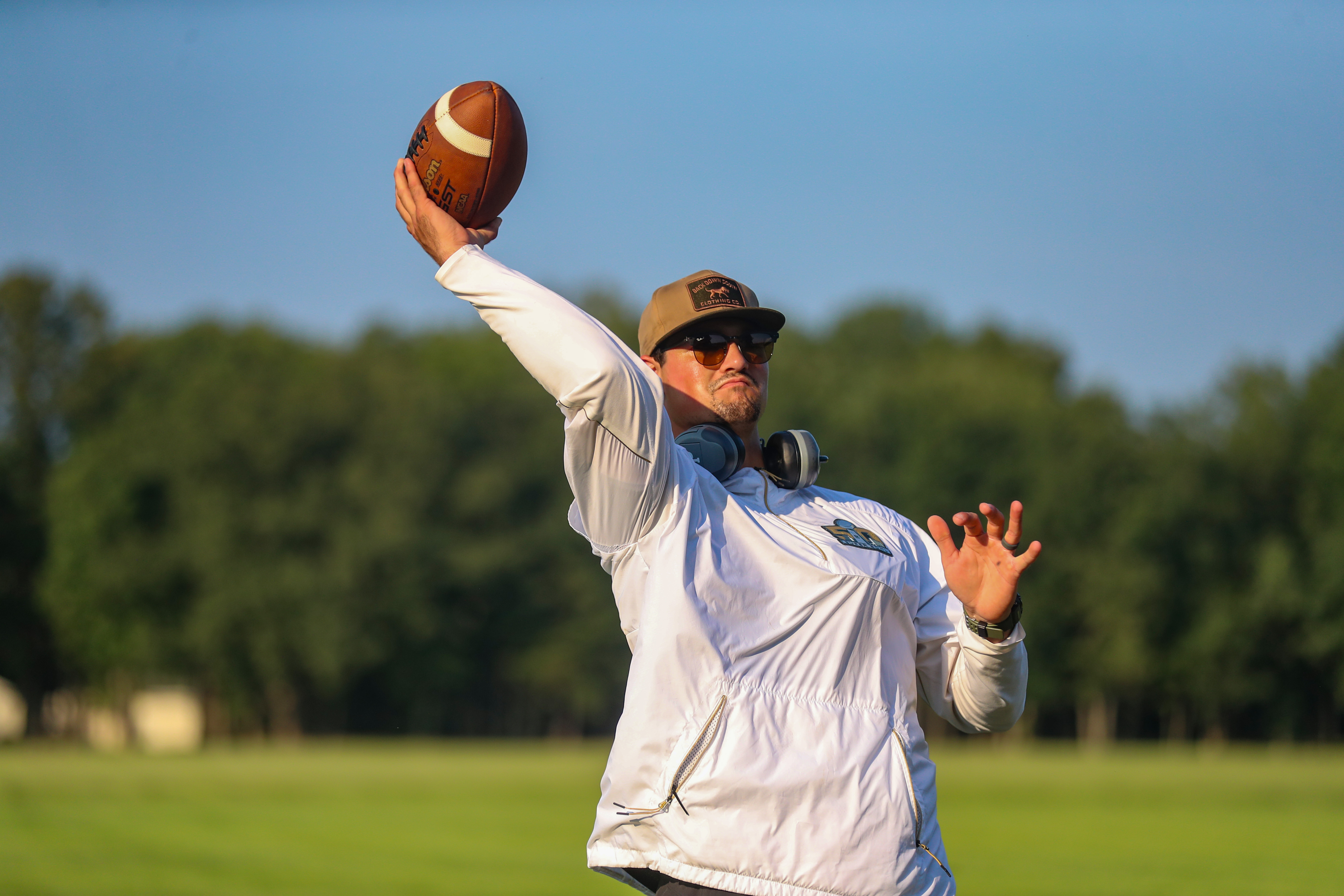 Former NFL quarterback Christian Hackenberg throws a pass during football practice at Winslow Township Middle School on Wednesday, August 25, 2021 in Atco, N.J. Hackenberg, the New York Jets second round draft pick in 2016, is now a volunteer assistant coach at Winslow High School in Camden County.