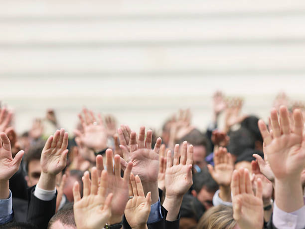 business-crowd-raising-hands-picture-id528070729