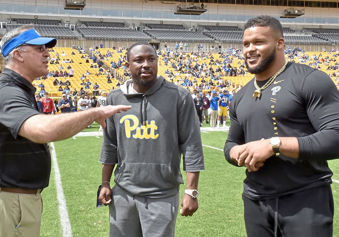 Pitt head coach Pat Narduzzi talks with honorary coaches LeSean McCoy and Aaron Donald before the team's spring game Saturday, April 13, 2019, at Heinz Field.