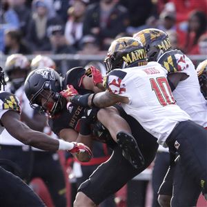 Rutgers tight end Nakia Griffin-Stewart is brought down by a host of Maryland players after making a catch during the first half of an NCAA college football game, Saturday, Nov. 4, 2017, in Piscataway, N.J.