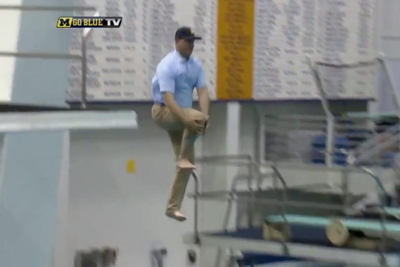 Jim-Harbaugh-Michigan-coach-does-can-opener-dive-into-pool-while-wearing-khakis.jpg