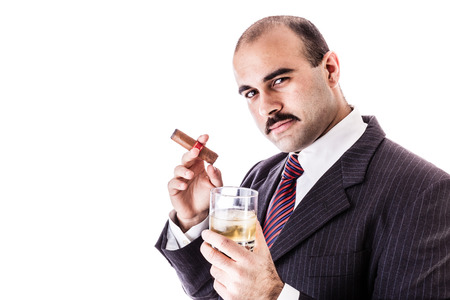 48138969-portrait-of-a-classy-businessman-toasting-with-a-glass-of-whiskey-and-smoking-a-cigar-isolated-over-.jpg